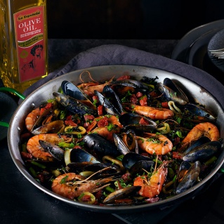 Black rice paella with seafood